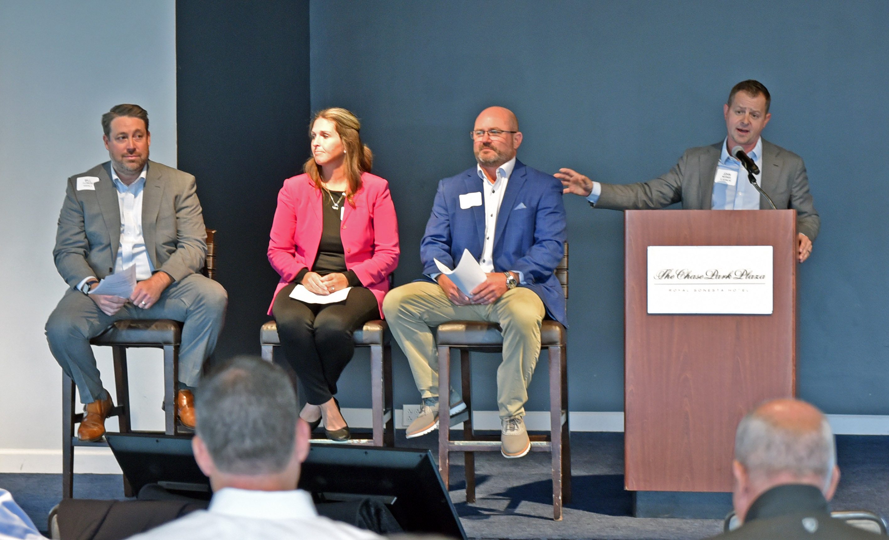 A panel of advisors sit onstage at the National Meeting