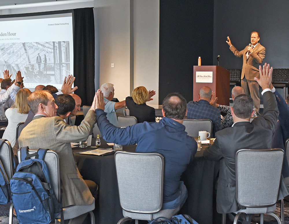 Advisors participate in an exercise during a presentation